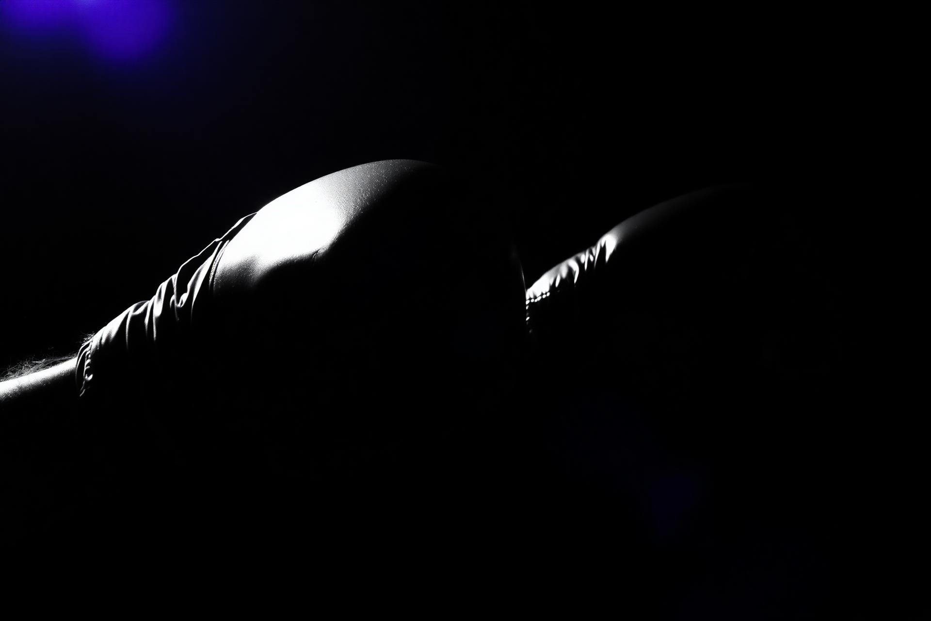 Boxing gloves in dramatic lighting